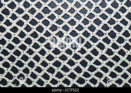 Weaving net from threads. mesh of tablecloth close up Stock Photo
