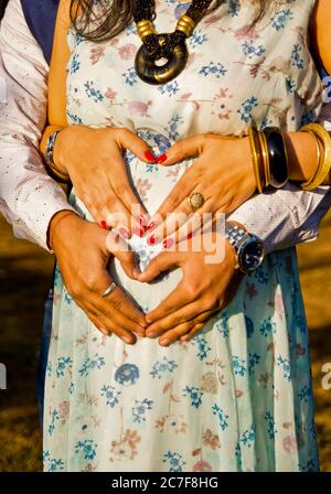 smiling multicultural friends with balloons and pregnant woman looking at  camera at baby-party Stock Photo - Alamy