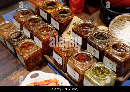 Various chilies in jars, market, Kuan Zhai Xiang Zi, Chengdu, Sichuan, China Stock Photo