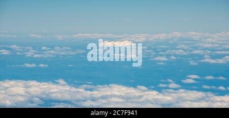 Summit of Mount Ruapehu looking out of the clouds, Aerial view, North Island, New Zealand Stock Photo