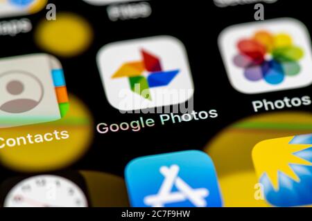 Google Photos and Apple Photos Icon, App Icons on a mobile phone display, iPhone, Smartphone, close-up Stock Photo