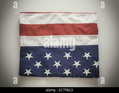 USA flag folded on white background. American flag with effect top view. Memorial day and 4th of July, Independence day concept Stock Photo