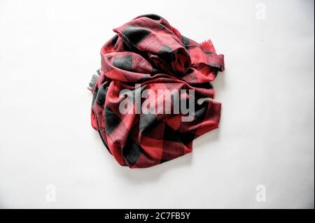High angle shot of red and black flannel on a white surface Stock Photo