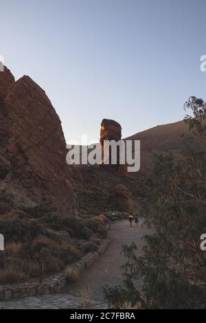 Scenery of people walking towards the mountains looking for adventures Stock Photo