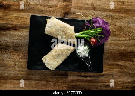 Vegetable Indian Rolls are filled with a tasty concoction of carrots, potatoes, pepper and peas cooked in a blend of Indian spices Stock Photo