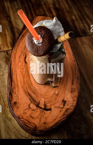 Big mug of hot cocoa with ice cream, whipped cream, chocolate chips and fluffy marshmallow, Cup of cold coffee, Coffee with Ice Cream, Coffee with Cho Stock Photo