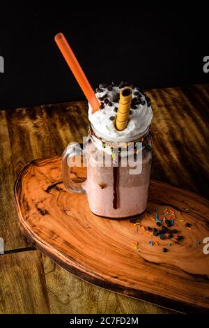 Big mug of hot cocoa with ice cream, whipped cream, chocolate chips and fluffy marshmallow, Cup of cold coffee, Coffee with Ice Cream, Coffee with Cho Stock Photo