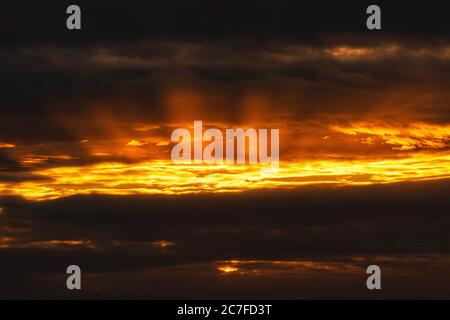 Panoramic view of dramatic clouds rising of sun floating in sky to change summer weather. Soft focus, blurred motion. Soft focus, motion blur sky Stock Photo