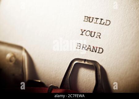 Build your brand text written with a typewriter. Stock Photo