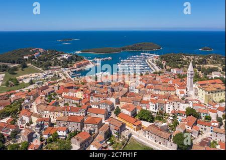 an aerial shot of coastal city Vrsar, island Sveti Juraj  in background Istria, Croatia