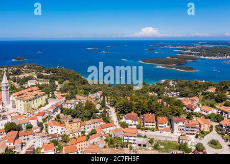 an aerial shot of coastal city Vrsar, ia lot of small islands in background, Istria, Croatia