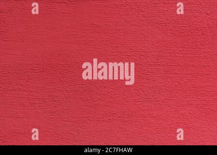 Bright rough plastered surface. Living coral colored. Backgrounds and textures. Stock Photo