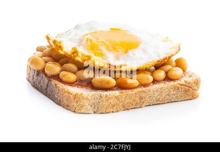Toast with fried egg and baked beans isolated on white background. Stock Photo