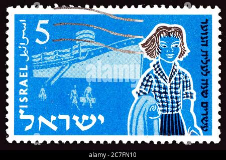 ISRAEL - CIRCA 1955: A stamp printed in Israel from the '20th anniversary of Youth Immigration Scheme' issue shows Immigrants - Aliyah and Ship, circa Stock Photo