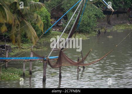 Chinese Fishing Nets, colloquially known as Cheena Vala, is a common sight in the backwaters of Kerala  Kochi. Stock Photo