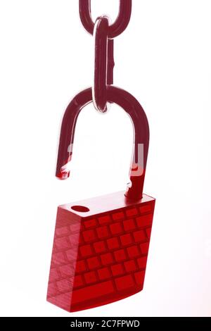 Isolated shot of a red padlock on a chain with a reflection of a keyboard on it - VPN concept Stock Photo