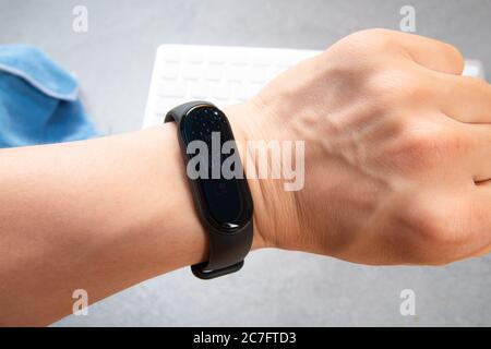 A sports bracelet on the arm Stock Photo