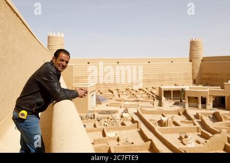 Raghba, Saudi Arabia, February 16 2020: A foreman poses on a castle wall at Raghba Fort. He directs the renovation of the fort Stock Photo