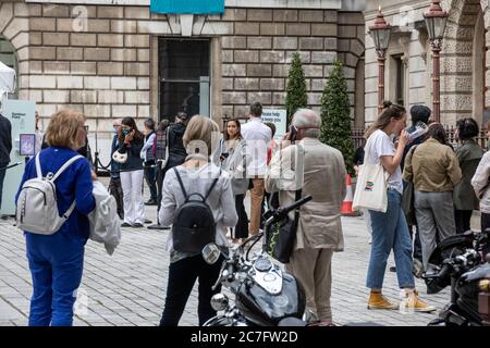 Queues of visitors outside the Royal Academy of Arts during the first days of reopening it's doors since the lockdown, Piccadilly, London, UK Stock Photo