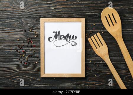 Frame with text Menu and cutlery on wooden background Stock Photo