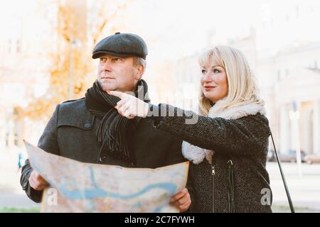 Happy blonde mature woman and handsome middle-aged brunette man Stock Photo