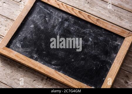 Blackboard on wooden background Stock Photo