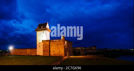 NARVA, ESTONIA - Aug 26, 2017: Narva Castle in Narva, Estonia on a stormy blue hour Stock Photo