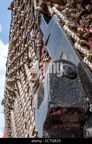 Close-up view of a mail bag snatching net seen on the side of an old British mail sorting train, standing discussed at a railway siding. Stock Photo