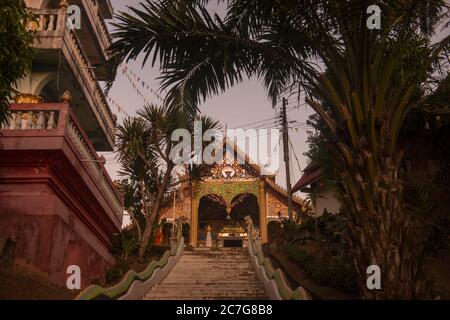 the Wat Chomkao Manilat at the Village of Huay Xai in Lao at the Mekong River from the view in the northwest Lao in Lao.   Lao, Huay Xay, November, 20 Stock Photo