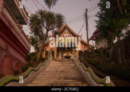 the Wat Chomkao Manilat at the Village of Huay Xai in Lao at the Mekong River from the view in the northwest Lao in Lao.   Lao, Huay Xay, November, 20 Stock Photo