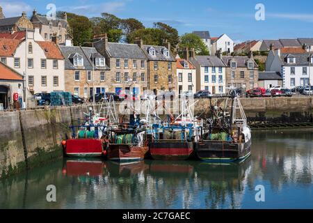 Fishing boats tied up in Pittenweem harbour in East Neuk of Fife, Scotland, UK Stock Photo