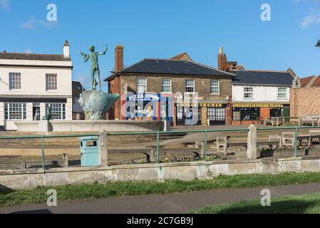 Braintree Essex, view of shops in the High Street in Braintree showing the fountain and sculpture titled Young Boy with Fish And Seals, England UK Stock Photo