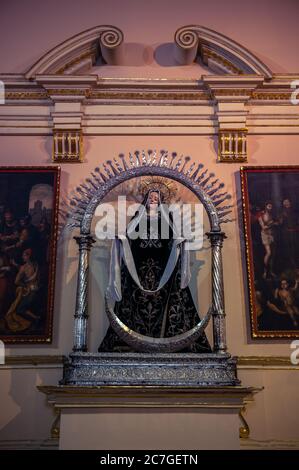 Vertical shot of a beautiful statue and painting in Bolivar Square, Bogota, Colombia Stock Photo