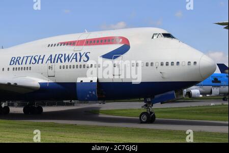 A British Airways Boeing 747 aircraft which first flew on the 18/09/1997, parked with its engines removed at Cotswold Airport, which is the home of Air Salvage international who dismantle end-of-life aircraft. The airline is to retire its fleet of Boeing 747s with immediate effect. Stock Photo