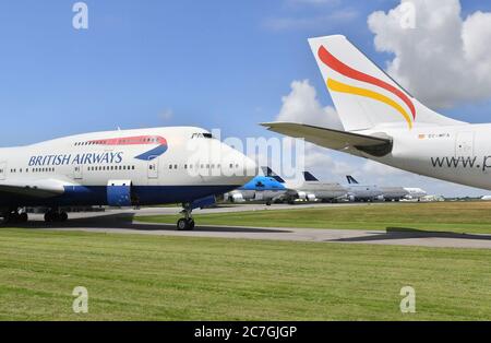 A British Airways Boeing 747 aircraft which first flew on the 18/09/1997, parked with its engines removed at Cotswold Airport, which is the home of Air Salvage international who dismantle end-of-life aircraft. The airline is to retire its fleet of Boeing 747s with immediate effect. Stock Photo