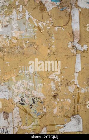 An old yellow weathered wall Stock Photo
