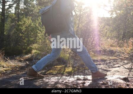 Man walking on a path through the forest Stock Photo
