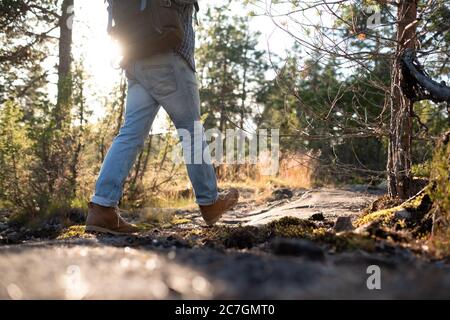 Man walking on a path through the forest Stock Photo