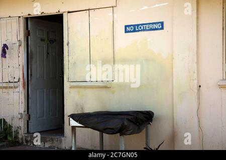 Road to Fort George Grenada sign 'no loitering' in Wooden Hut Stock Photo