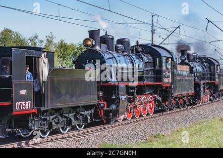 Moscow, Russia - August 30, 2019: Steam locomotives moves along the forest. Stock Photo