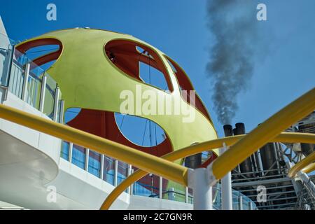 Horizontal shot of black pollution smoke coming out of cruise ship Stock Photo