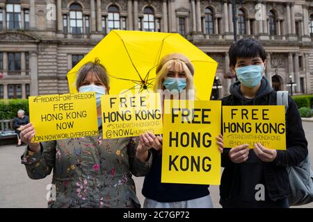 Glasgow, Scotland, UK. 17 July, 2020. Protesters from The Democracy in Hong Kong in Scotland group at a Fridays for Freedom Hong Kong democracy protest held in George Square Glasgow and in other major cities around the world today. Fridays for Freedom protests are intended to highlight the attack on human rights and freedom by the Chinese Government on Hong Kong and in China. Further Friday protests are planned in the following weeks. Iain Masterton/Alamy Live News Stock Photo