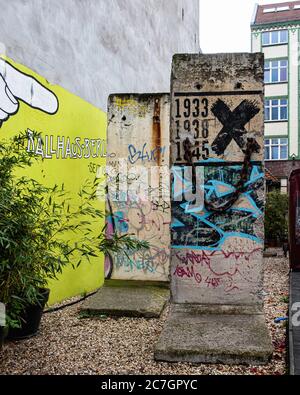 Sections of the Berlin Wall in the courtyard of the historic Ballhaus Berlin at  Chausseestrasse 102, Mitte, Berlin Stock Photo