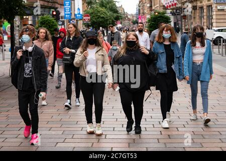 Glasgow, Scotland, UK. 17 July, 2020.  Images from Glasgow city centre as covid-19 restrictions are relaxed and  the public are out and about shopping and at work. Pictured; Young women walking on Buchanan Street wearing face coverings. Iain Masterton/Alamy Live News Stock Photo