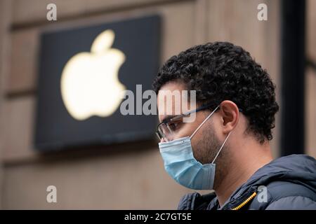 Glasgow, Scotland, UK. 17 July, 2020.  Images from Glasgow city centre as covid-19 restrictions are relaxed and  the public are out and about shopping and at work. Pictured; Man wearing facemark waiting in queue outside Apple shop. Iain Masterton/Alamy Live News Stock Photo