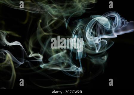 Abstract green smoke background with smooth shape in black backdrop Stock Photo