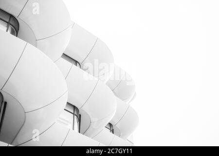Modern architecture of a building in the city. Curves and straight lines. Minimal futuristic design.  Black and White. Stock Photo