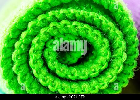 Background made of green curled microfiber material, front view, macro shot. Stock Photo