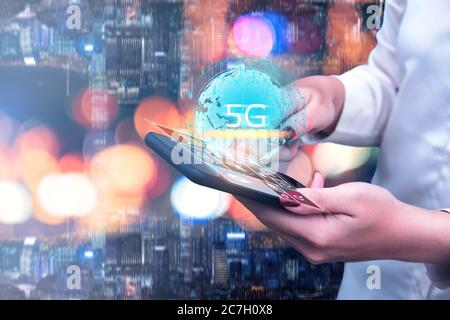 5G technology and global communication concept, Woman  using smart phone with world hologram, network, connection, internet in modern city Stock Photo