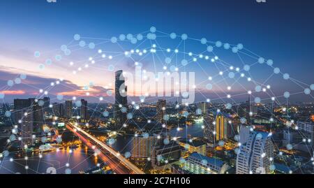 Wireless network technology and Connection concept, Network on city background Stock Photo